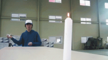 Throwing card puts out candle flame